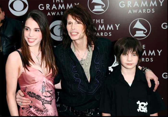 Steven Tyler taking picture with his children.